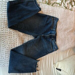 Vince Camuto dark wash skinny jeans with raw hem. Size 12/31, gently worn.